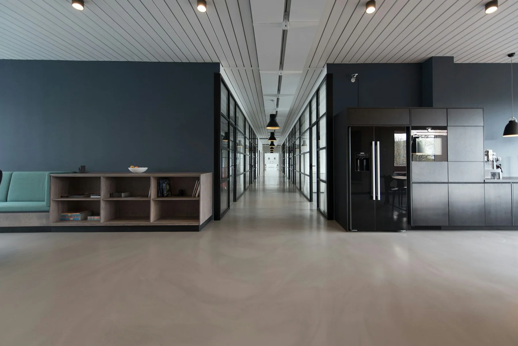 An empty meeting room in a modern apartment common space, waiting for a board meeting to begin.