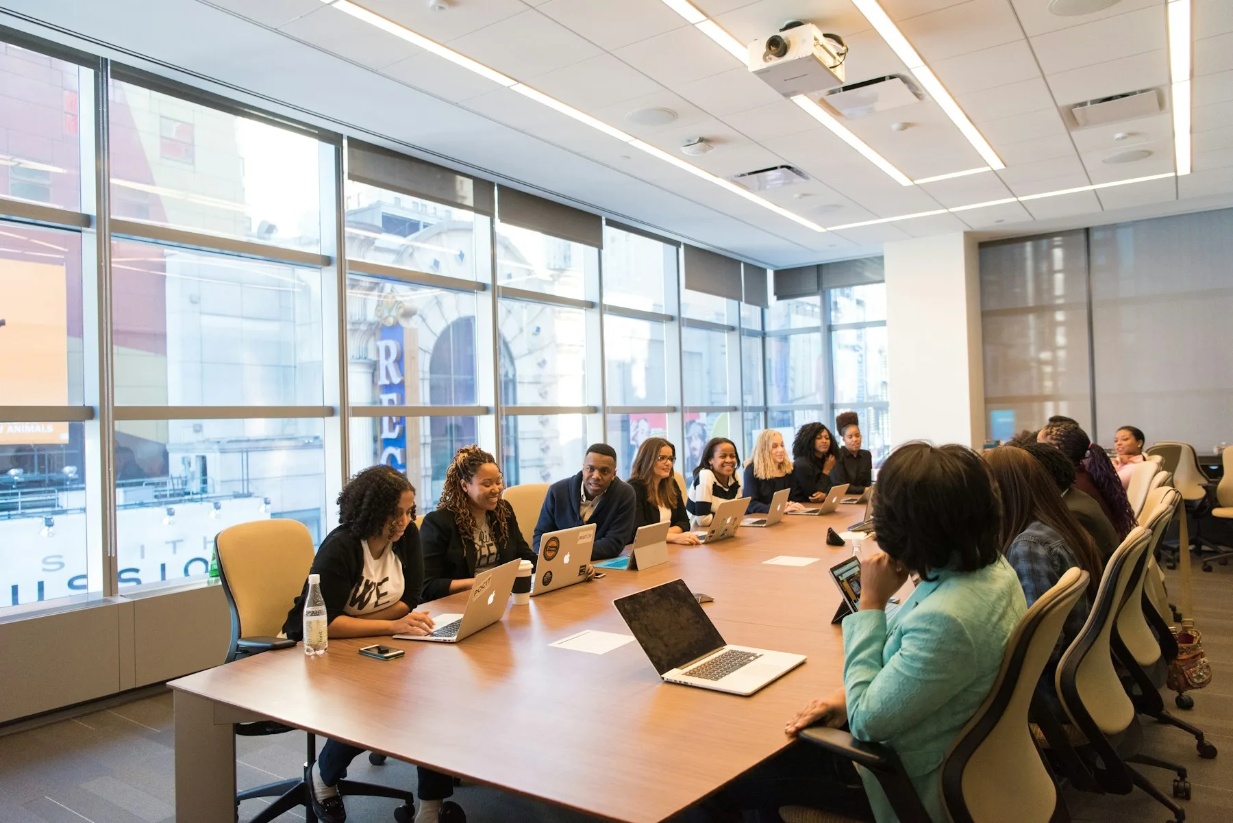 A resident committee-style meeting in a bright conference room.